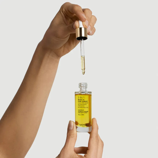 Pipette d'Huile Précieuse Muesli & Pure Vanille Yodi au-dessus de son flacon